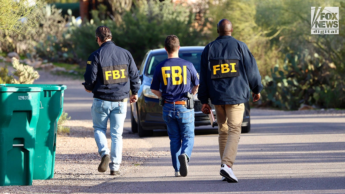FBI agents canvassing a residential neighborhood near Nancy Guthrie's home