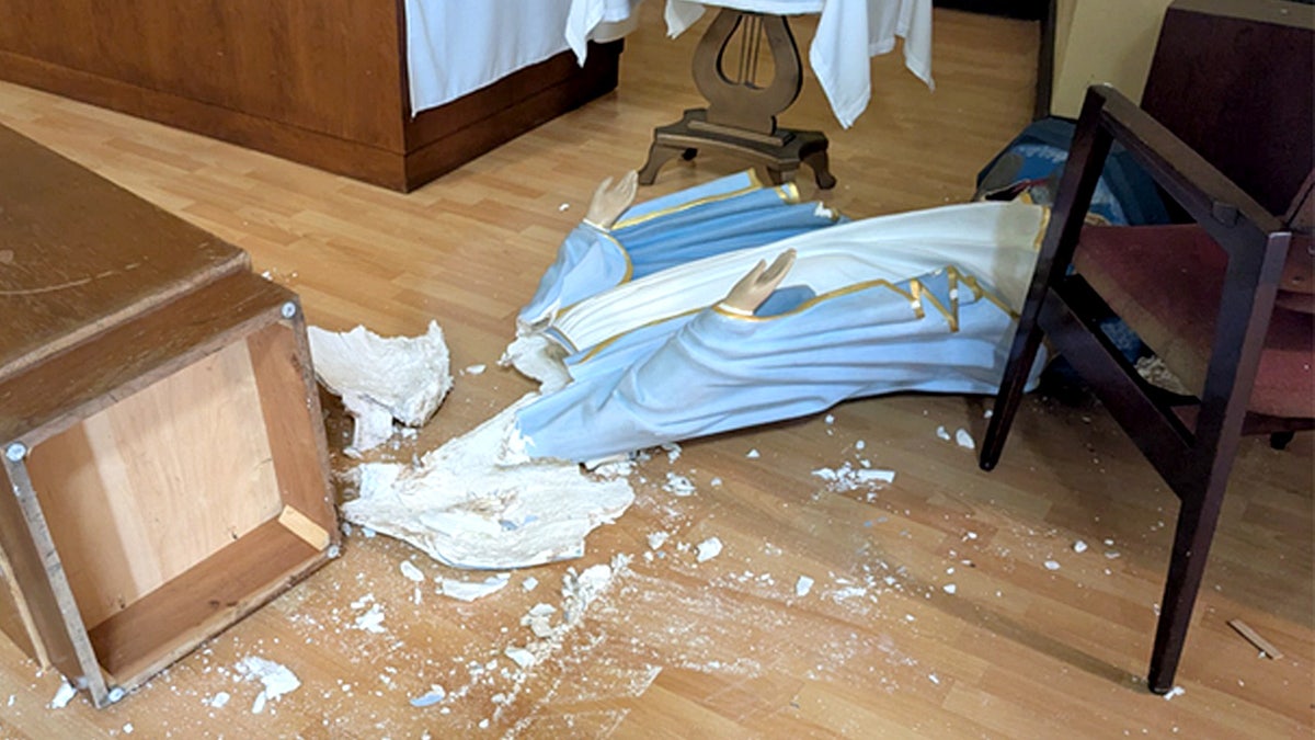 Broken statue of the Virgin Mary.