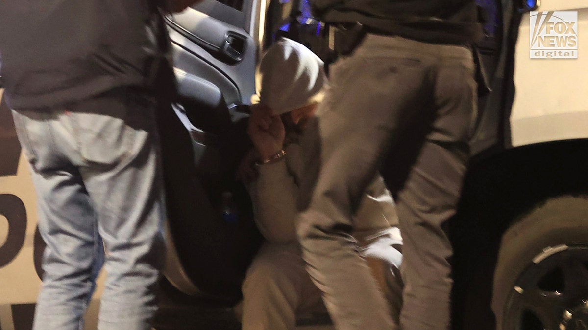A man being detained by law enforcement following a traffic stop in Tucson, Arizona