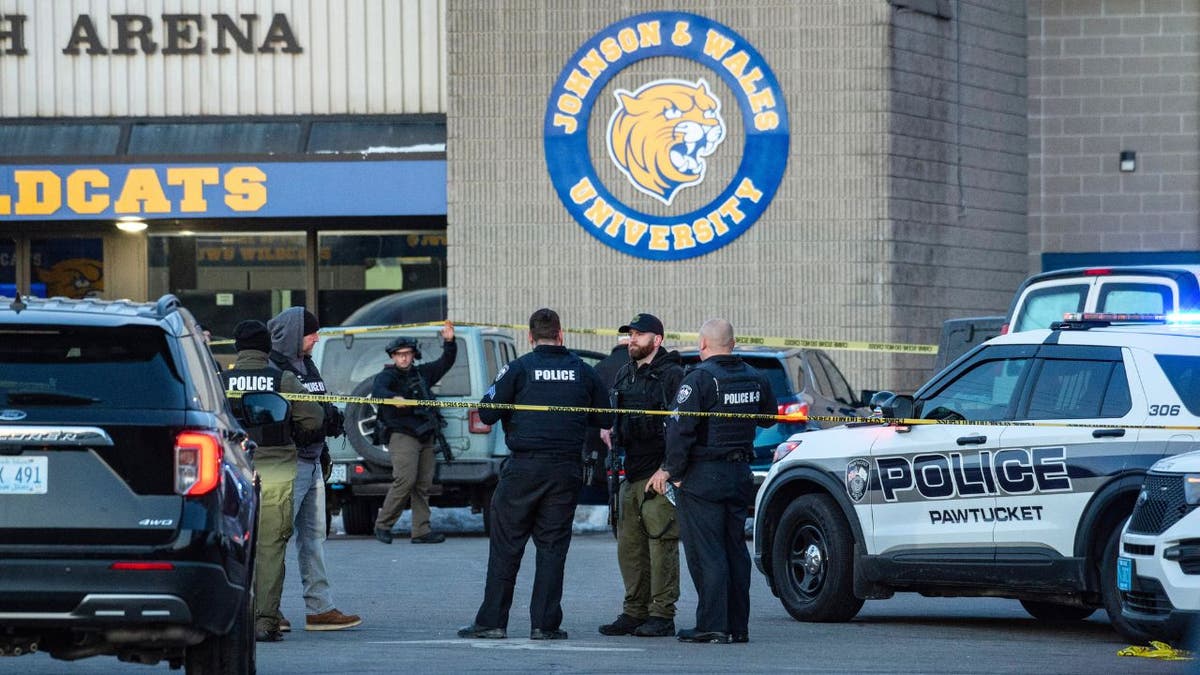 Police officers and patrol vehicles outside Dennis M. Lynch Arena in Pawtucket, Rhode Island after a shooting.