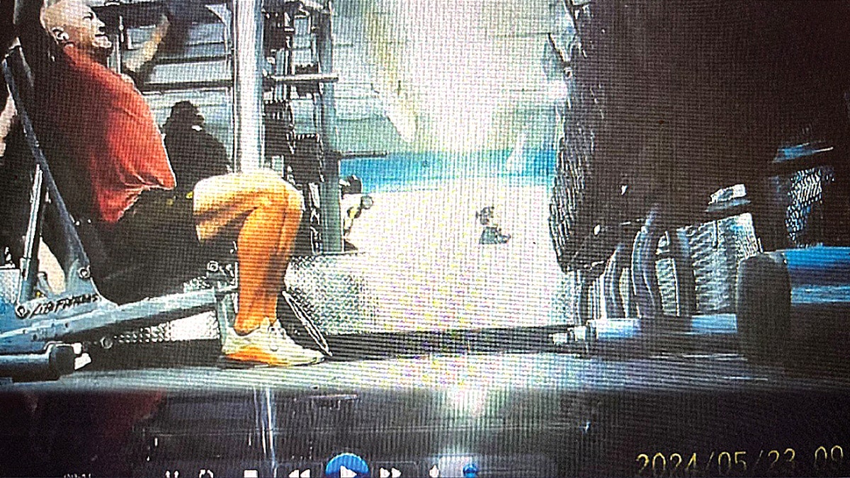 screengrab of man working out deltoids