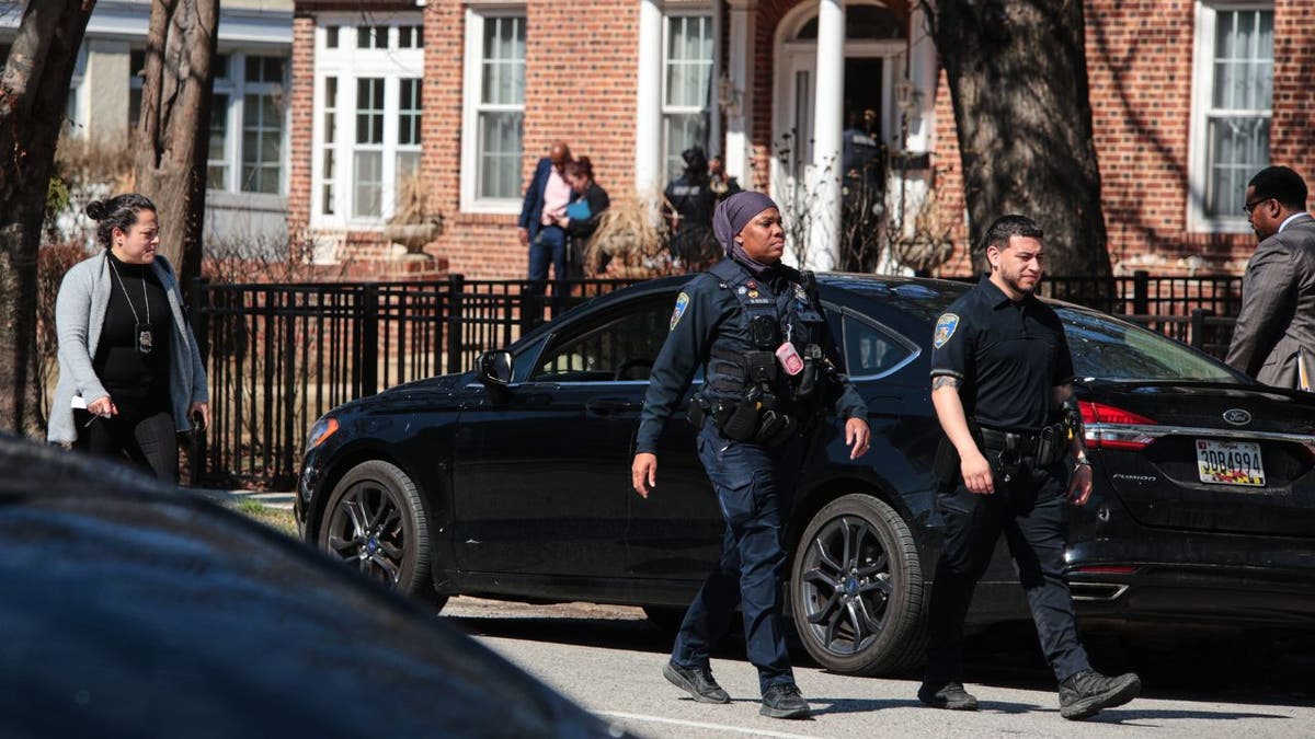 Baltimore police officers at the scene of an active shooter incident on Park Heights Avenue.