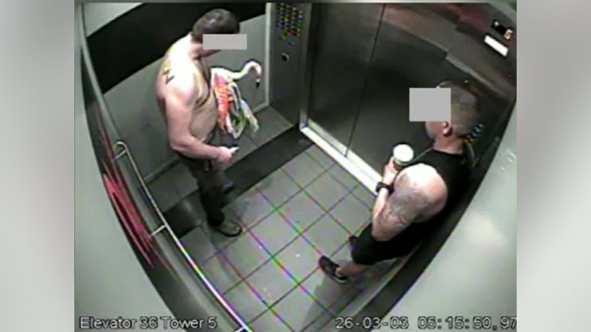 Surveillance video of two men with a flamingo in an elevator.