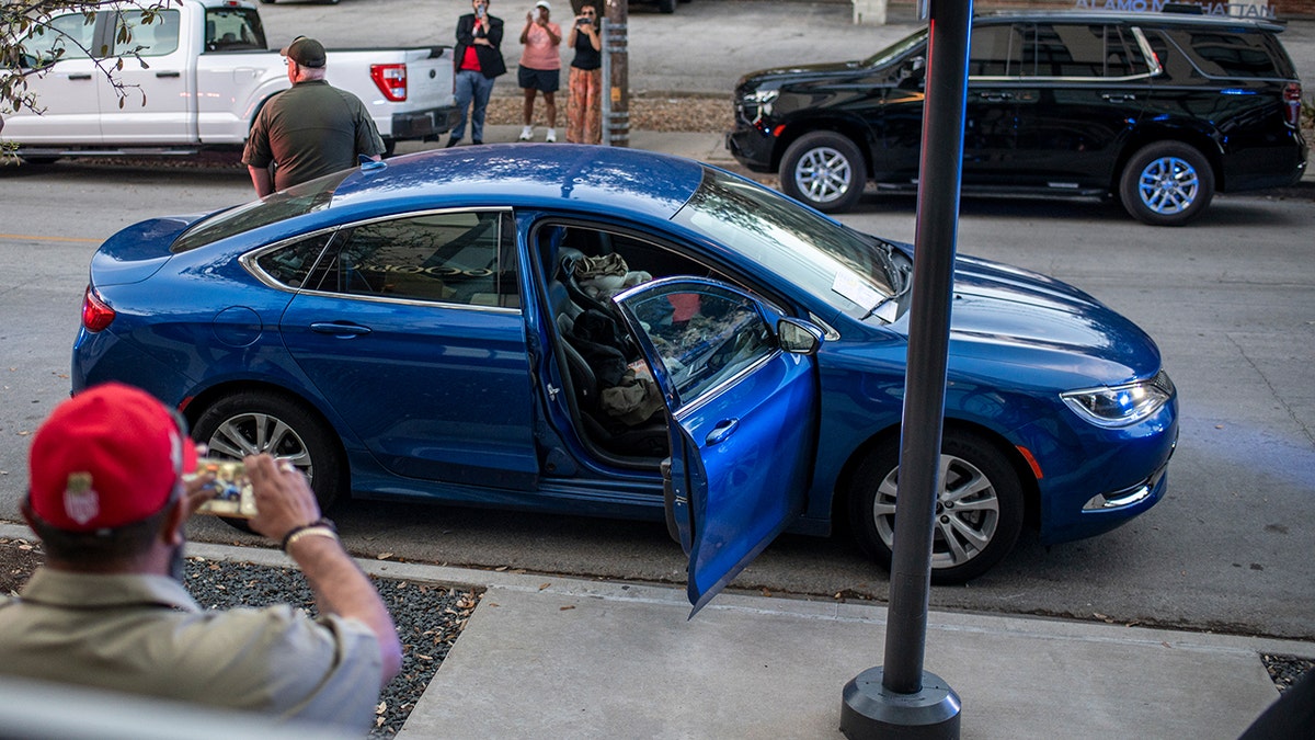 Suspect's car outside Ken Paxton headquarters