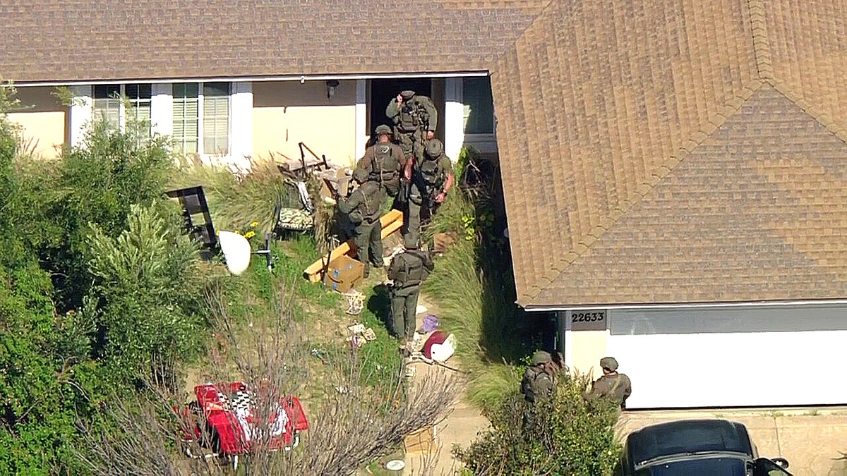 SWAT crews enter home