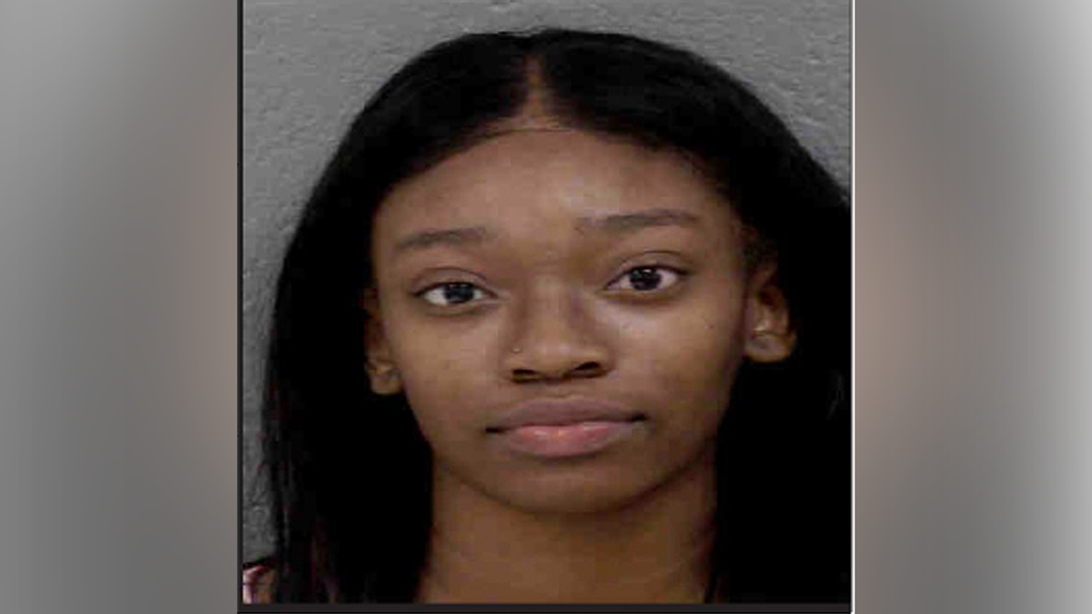 Tanaezah Michelle Austin booking photo following arrest in Charlotte street takeover investigation